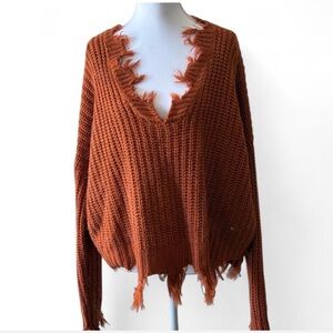 Cozy Burnt Orange V-Neck Sweater with Distressed Edges